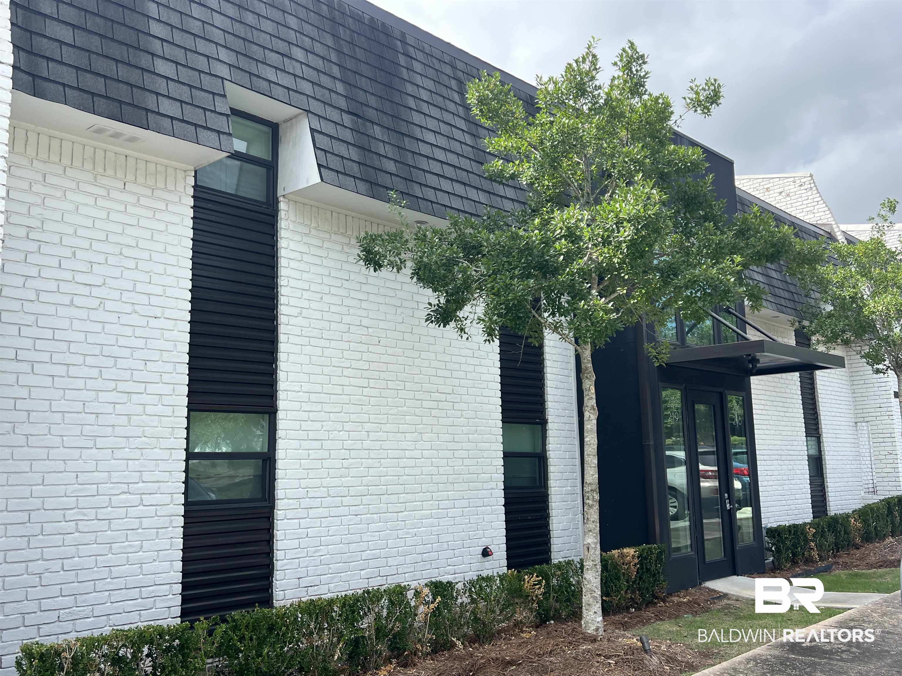 3655 Old Shell Road, Unit 219 Mobile, AL 36608 - Photo 25 of 25 View of property exterior featuring brick siding and mansard roof