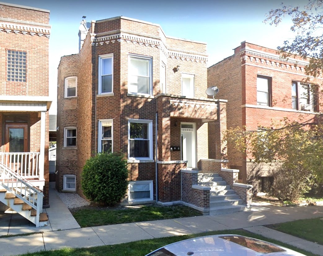 2904 West Nelson Street, Unit 2 Chicago, IL 60618 - Photo 1 of 12 a view of a building with a yard