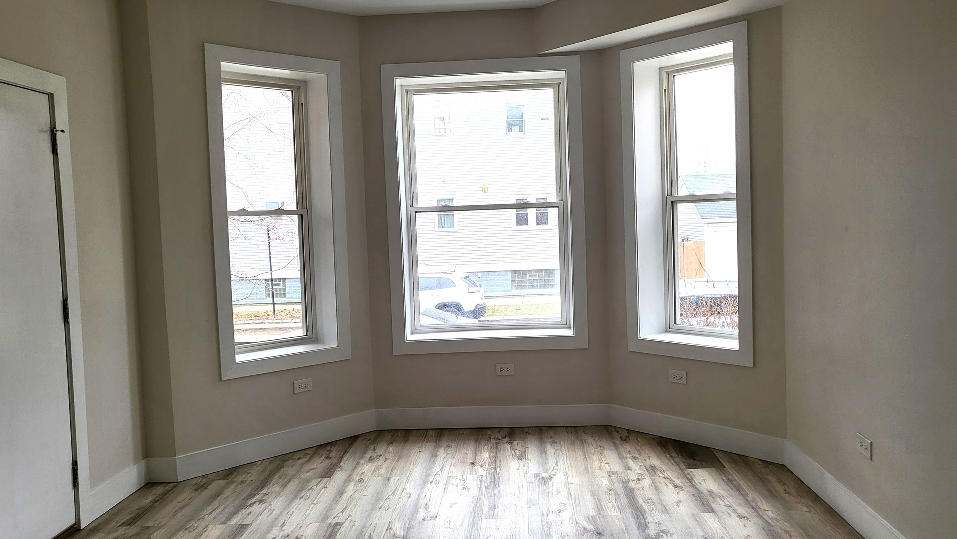 2904 West Nelson Street, Unit 2 Chicago, IL 60618 - Photo 4 of 12 a view of an empty room and window