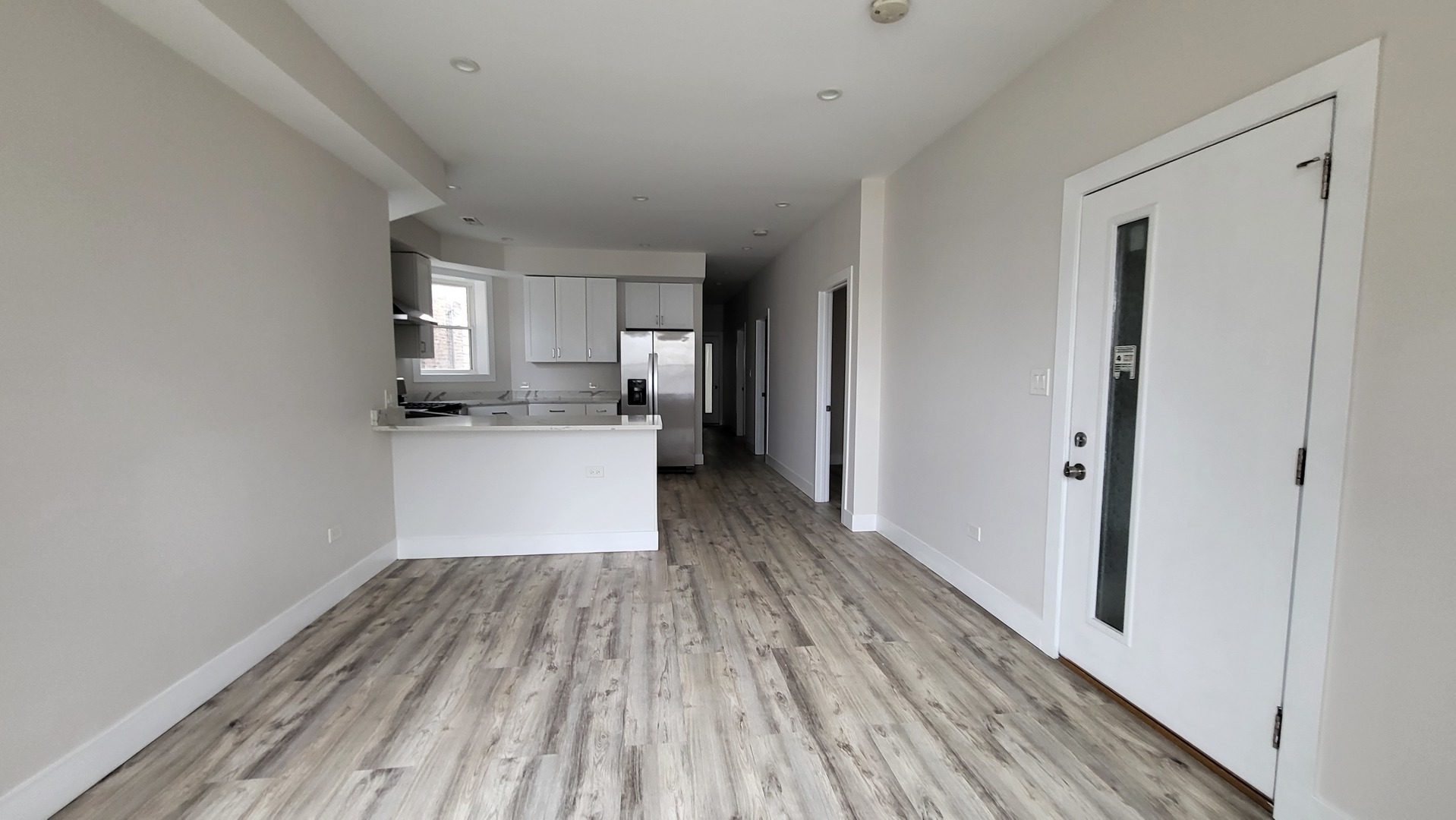 2904 West Nelson Street, Unit 2 Chicago, IL 60618 - Photo 8 of 12 a view of a kitchen from the hallway
