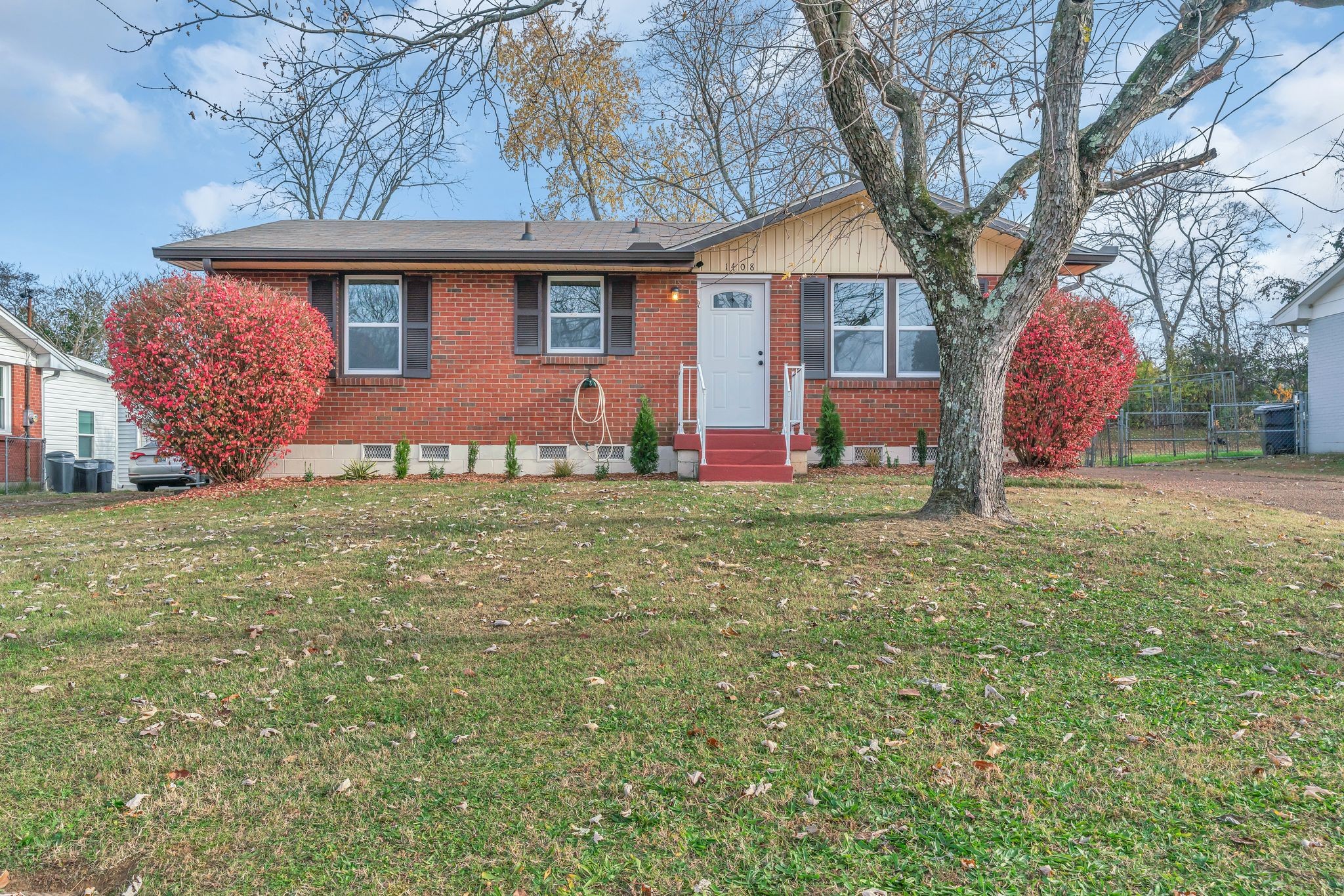 1408 Bain Drive Madison, TN 37115 - Photo 1 of 32 a front view of a house with garden