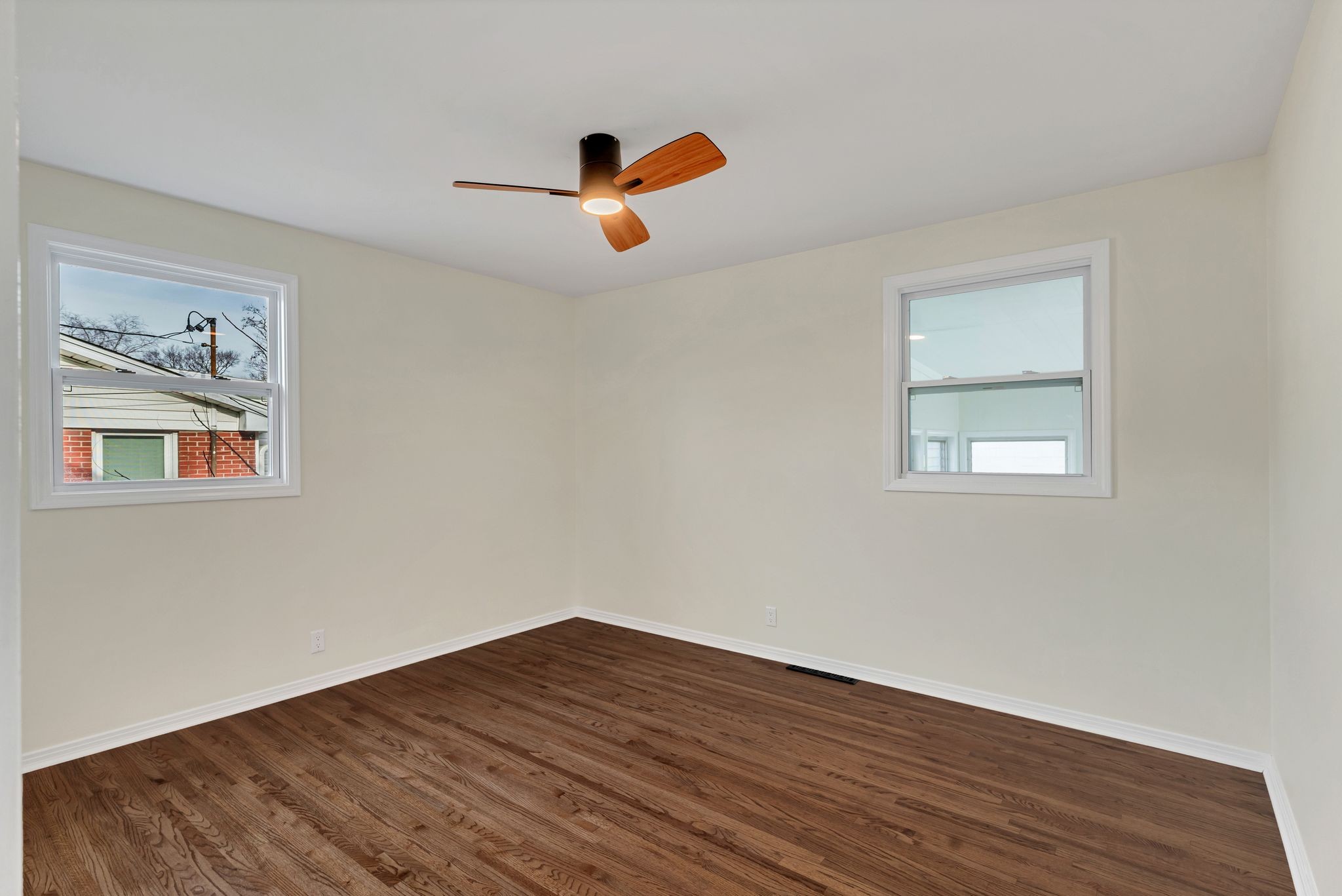 1408 Bain Drive Madison, TN 37115 - Photo 19 of 32 a view of an empty room with wooden floor and window