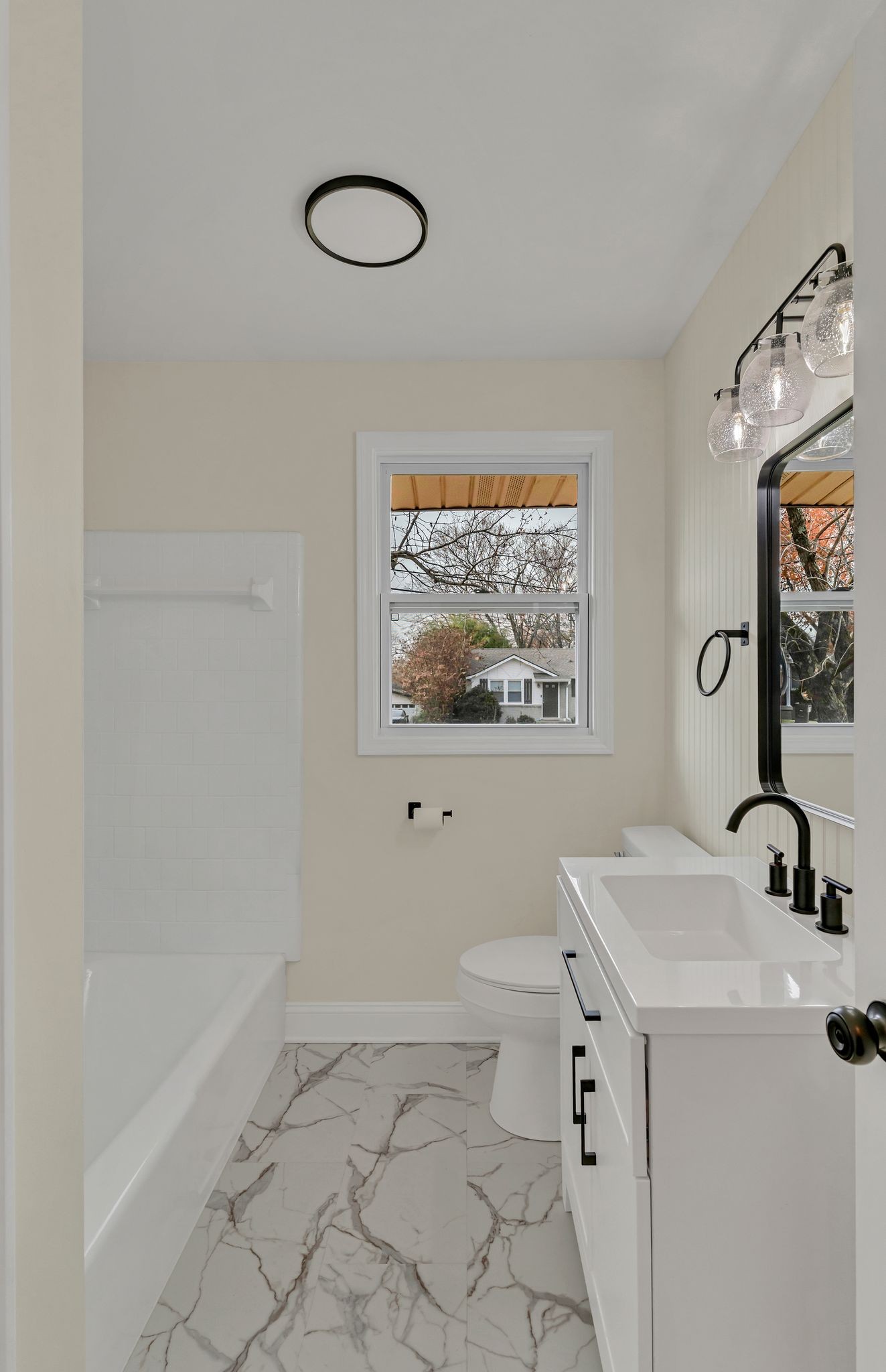 1408 Bain Drive Madison, TN 37115 - Photo 10 of 32 a bathroom with a sink a mirror and a toilet