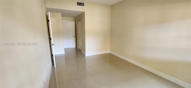 a view of a small space with wooden floor