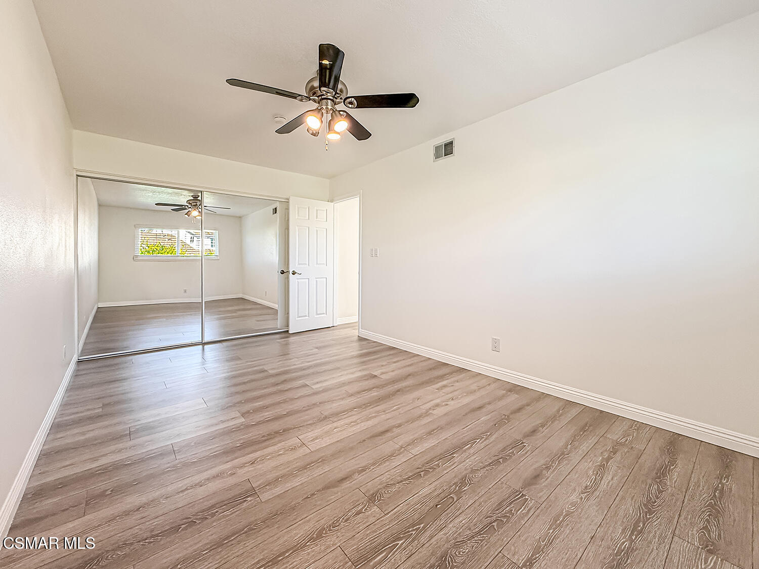 2561 Heywood Street Simi Valley, CA 93065 - Photo 19 of 31 an empty room with wooden floor and windows