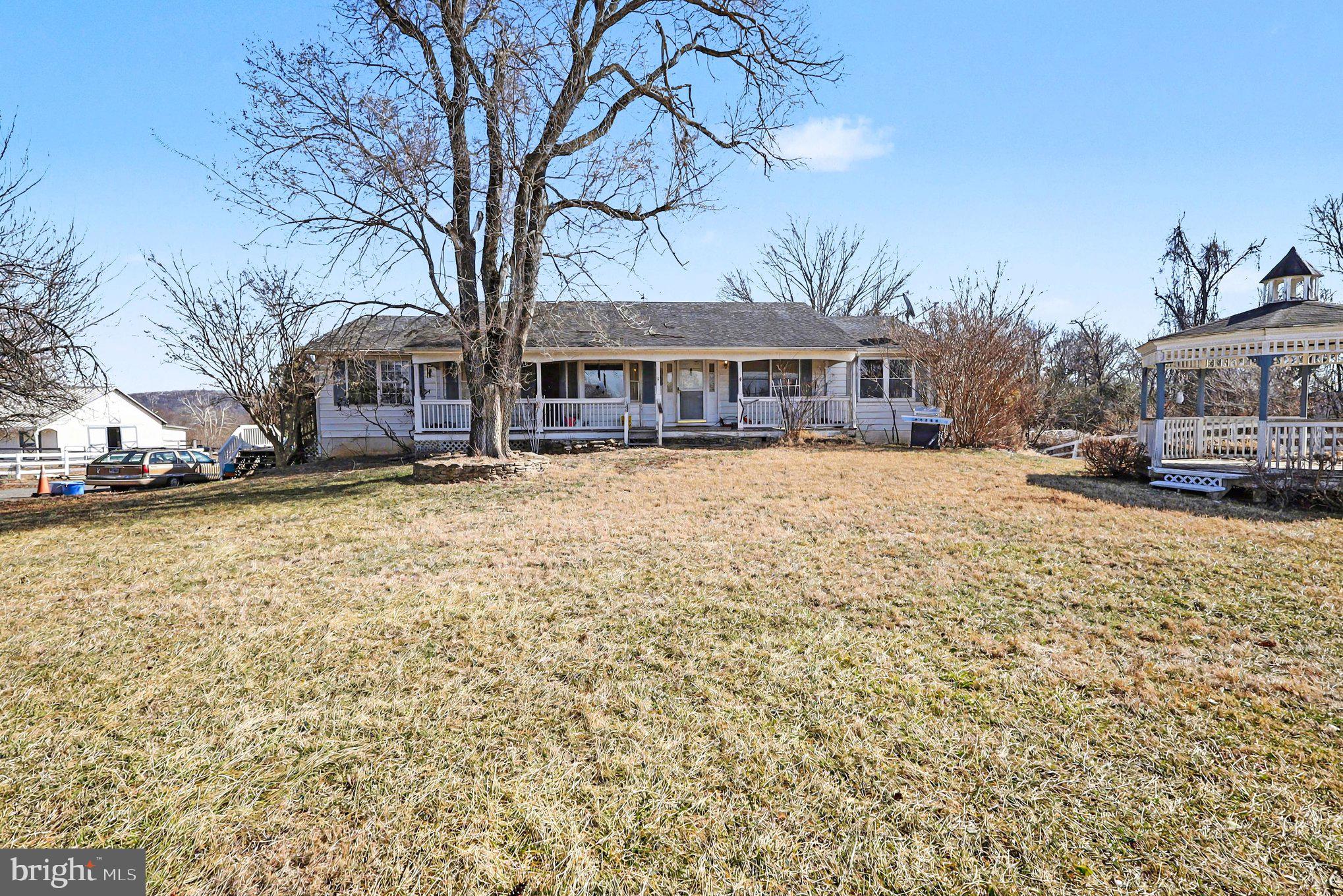 22244 Sam Fred Road Middleburg, VA 20117 - Photo 18 of 51 a view of a house with a yard covered with snow in the front