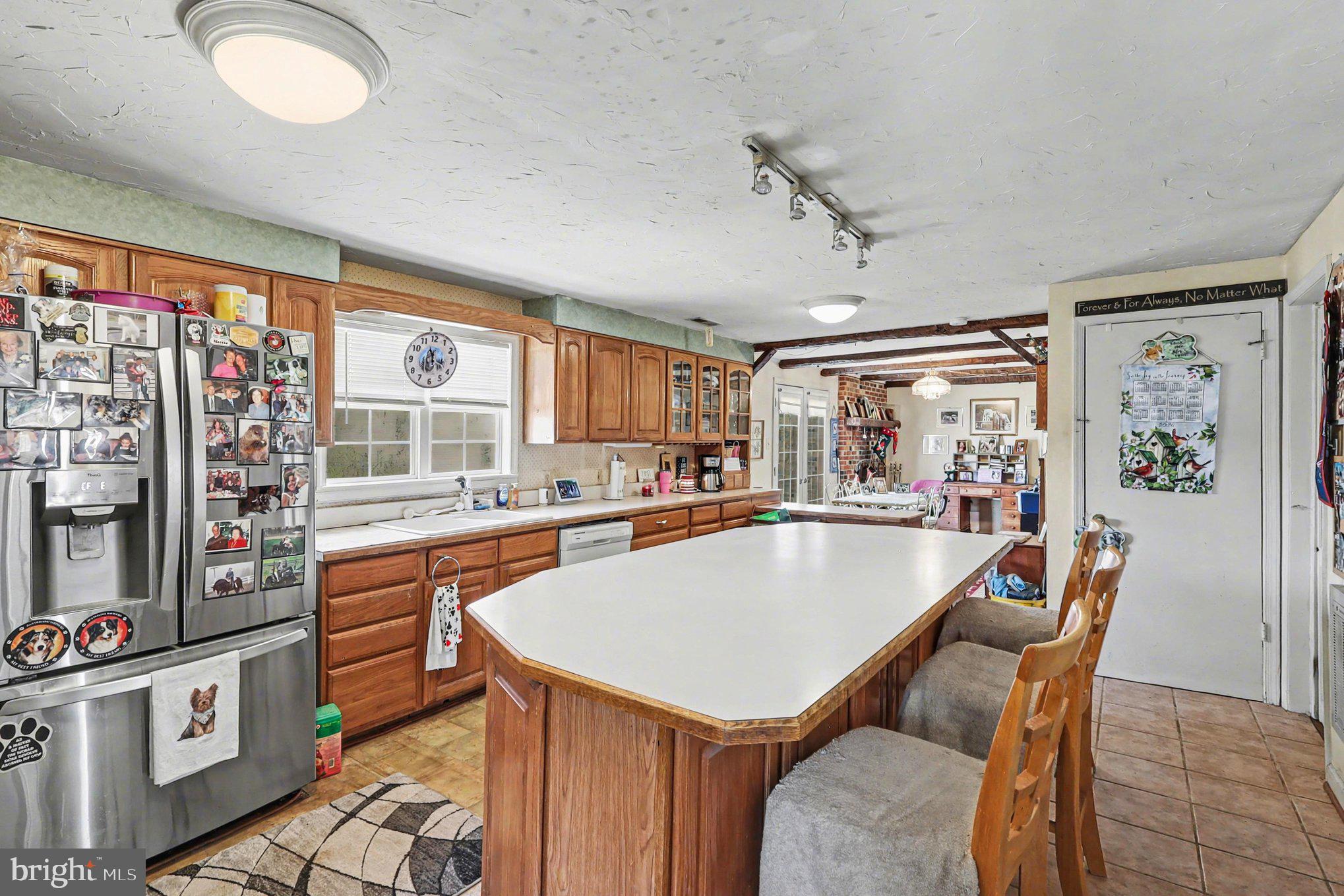 22244 Sam Fred Road Middleburg, VA 20117 - Photo 21 of 51 a dining table with chairs and window