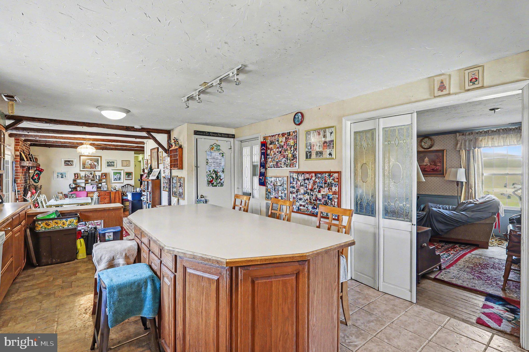 22244 Sam Fred Road Middleburg, VA 20117 - Photo 23 of 51 a view of kitchen island kitchen island dining table and chairs