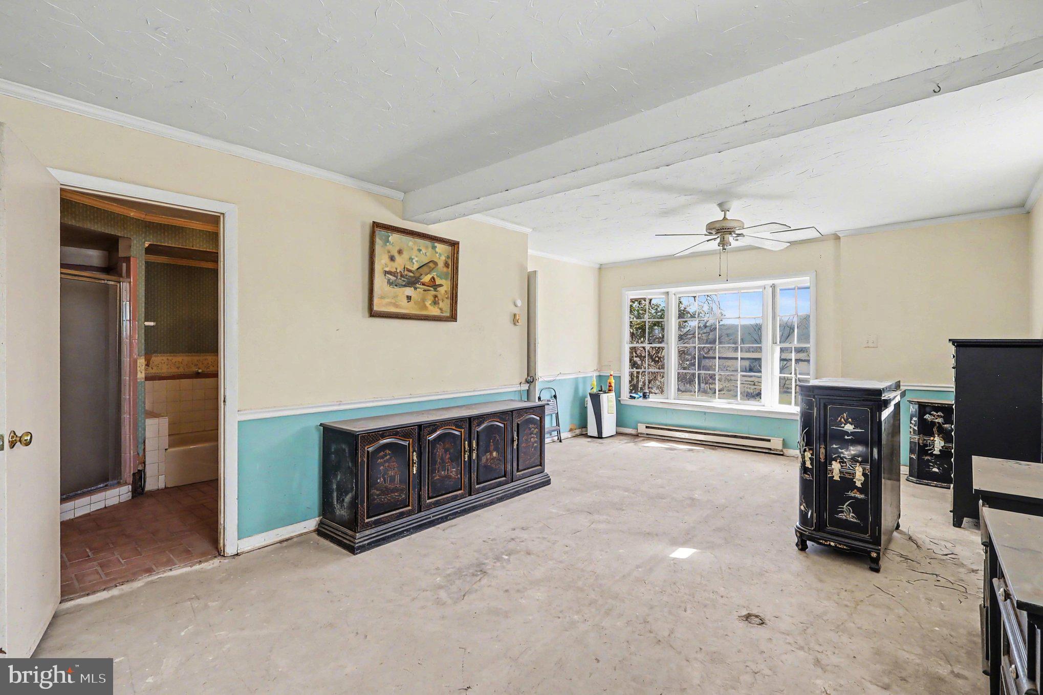22244 Sam Fred Road Middleburg, VA 20117 - Photo 38 of 51 an empty room with furniture and windows