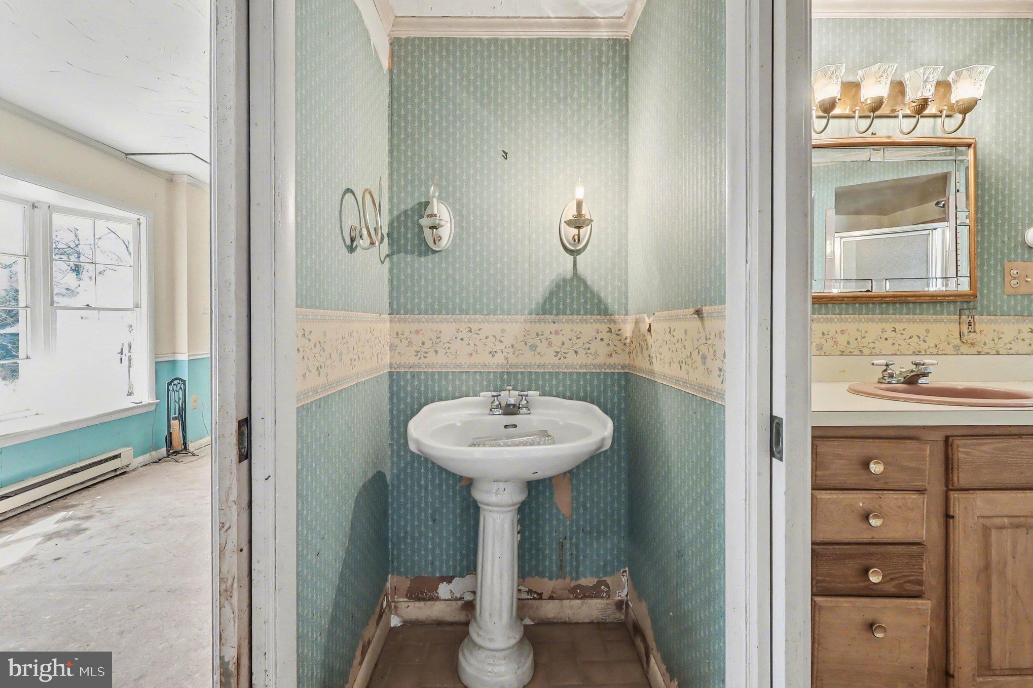 22244 Sam Fred Road Middleburg, VA 20117 - Photo 40 of 51 a bathroom with a sink and a mirror