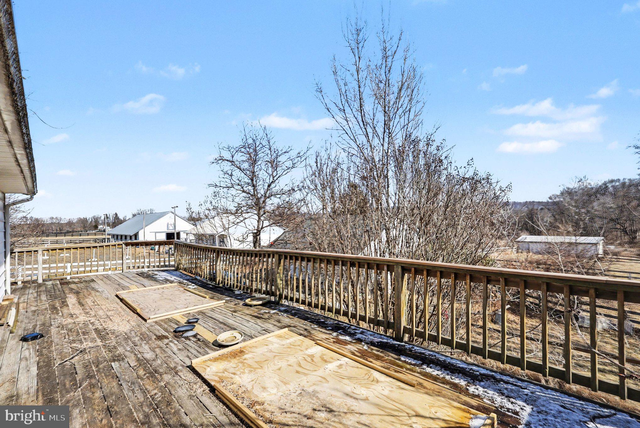 22244 Sam Fred Road Middleburg, VA 20117 - Photo 47 of 51 a view of balcony with wooden floor and fence