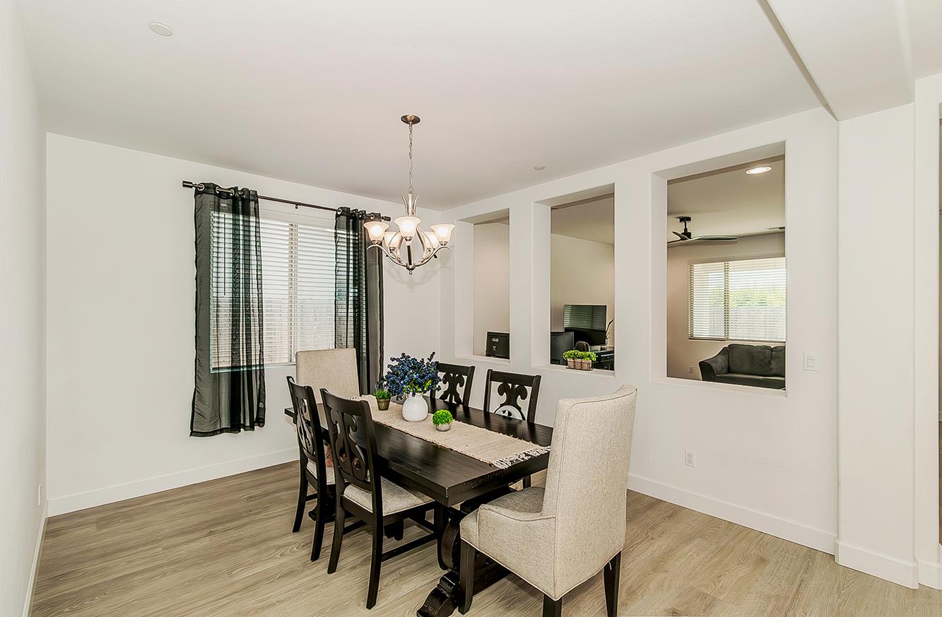 117 Emperor Way Dinuba, CA 93618 - Photo 9 of 32 a view of a dining room with furniture and window