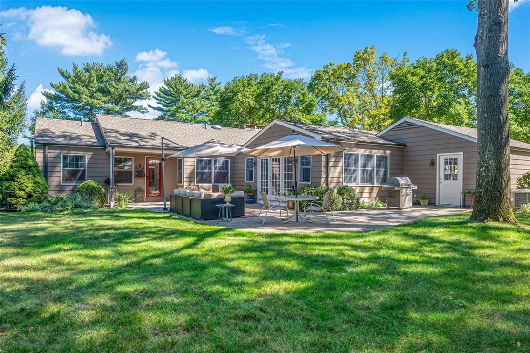 6 Old Orchard Road Rye Brook, NY 10573 - Photo 1 of 1 a front view of a house with swimming pool having outdoor seating
