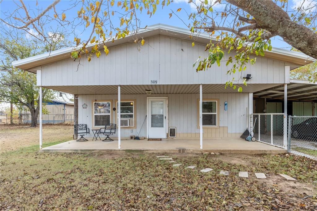 309 Goodwin Street Bangs, TX 76823 - Photo 2 of 20 Rear view of house with a porch