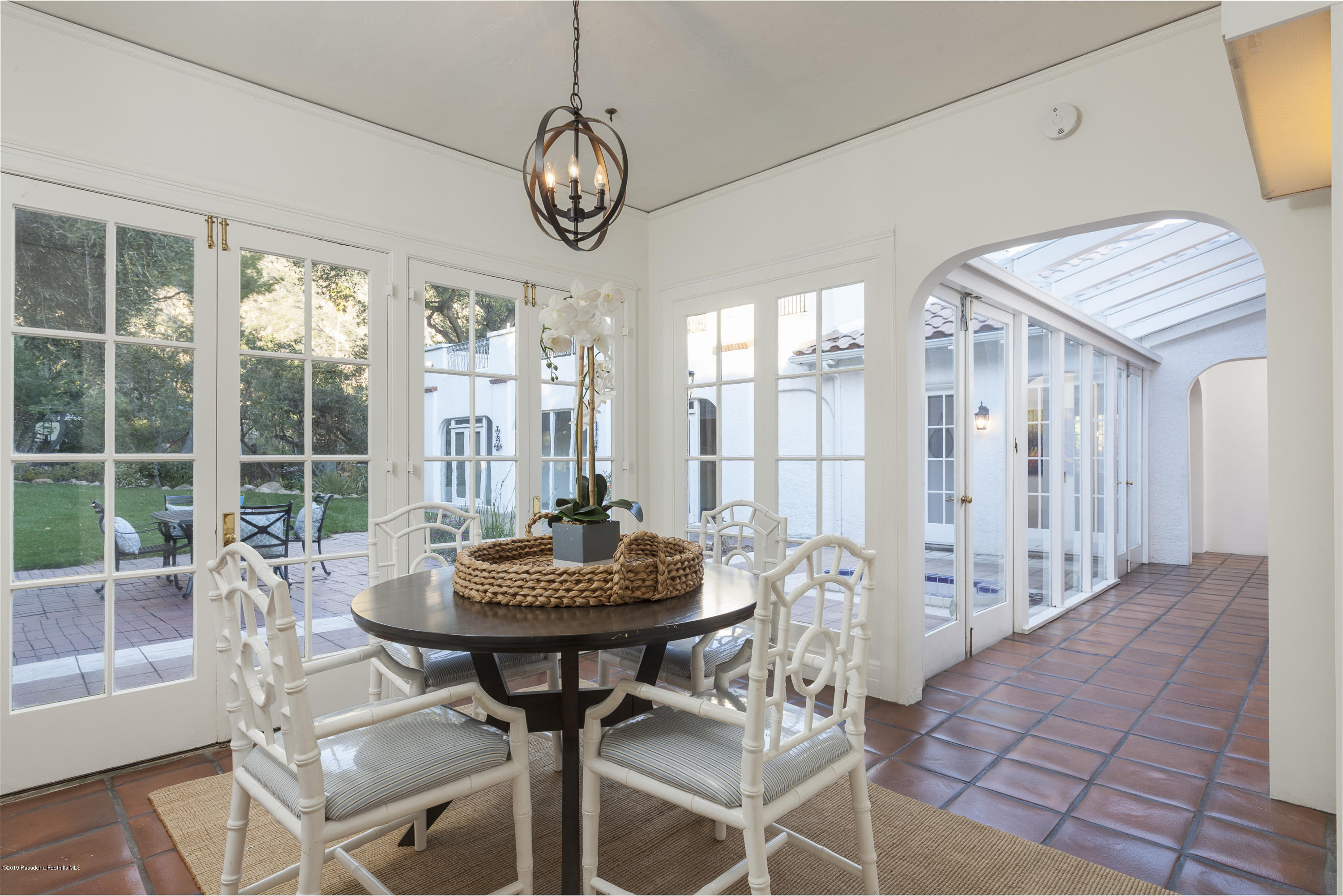 3130 Maiden Lane Altadena, CA 91001 - Photo 22 of 89 a view of a dining room with furniture large windows and wooden floor