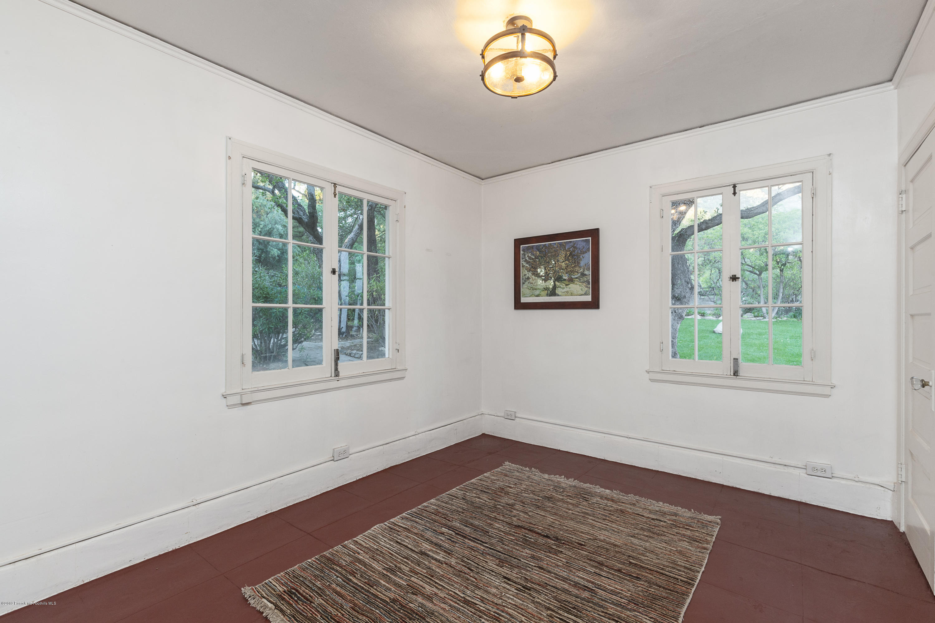 3130 Maiden Lane Altadena, CA 91001 - Photo 29 of 89 an empty room with wooden floor and windows
