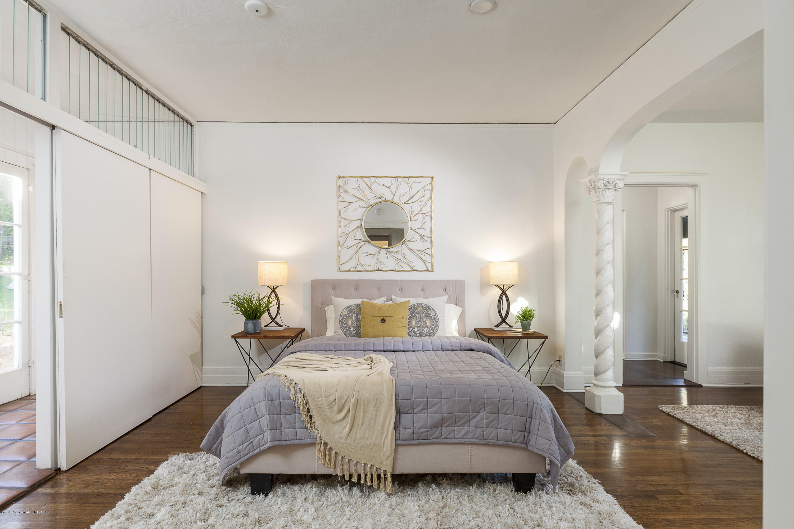 3130 Maiden Lane Altadena, CA 91001 - Photo 36 of 89 a bedroom with a bed table and a window