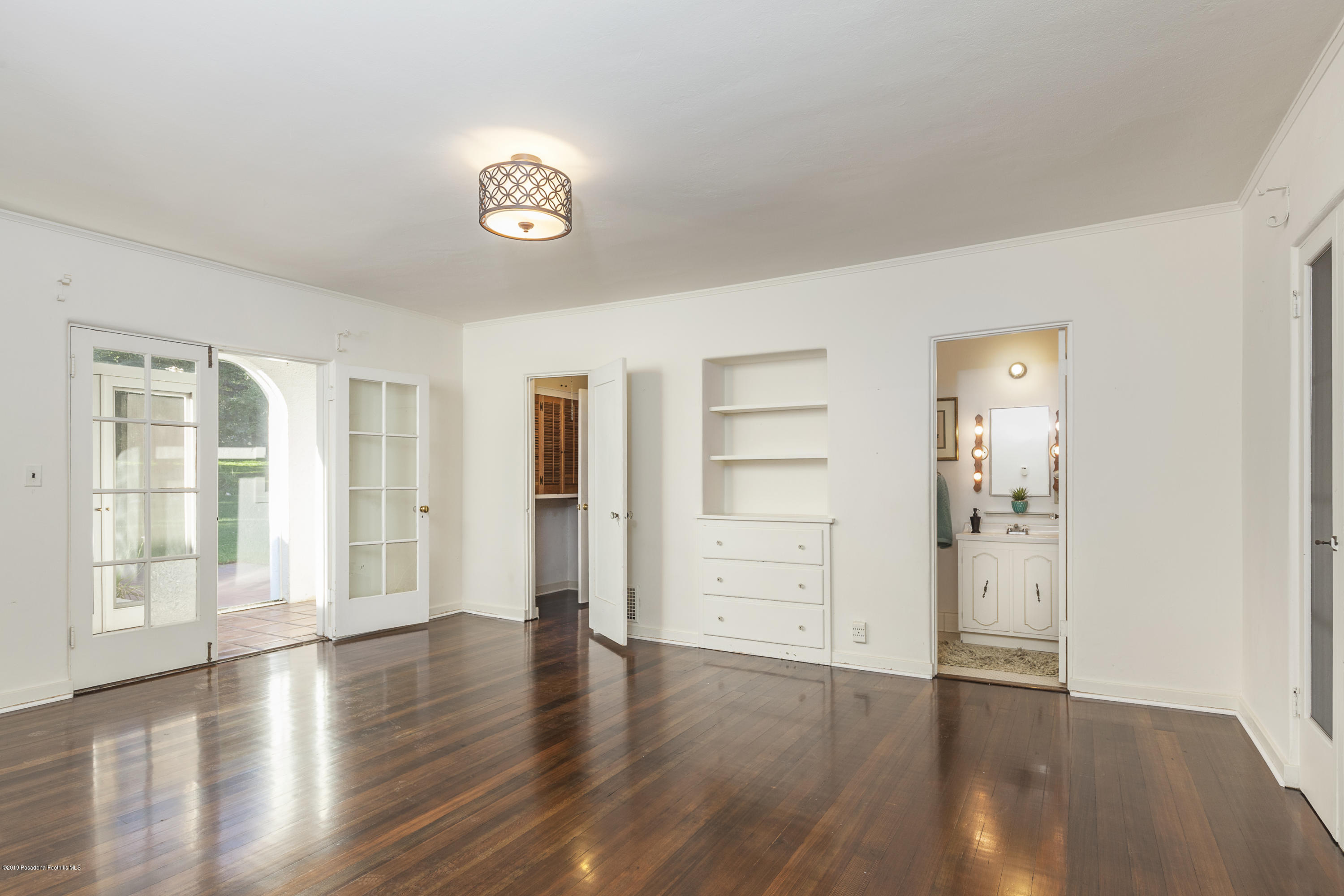 3130 Maiden Lane Altadena, CA 91001 - Photo 42 of 89 an empty room with wooden floor cabinet and windows