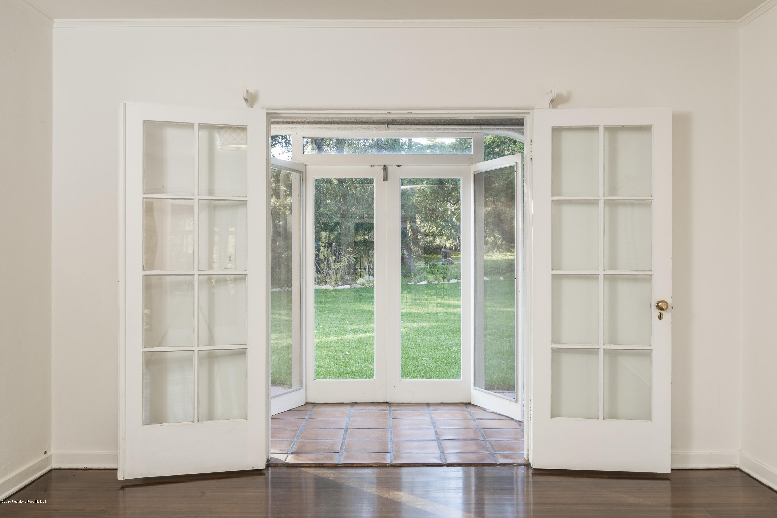 3130 Maiden Lane Altadena, CA 91001 - Photo 48 of 89 a view of an empty room with wooden floor and a window