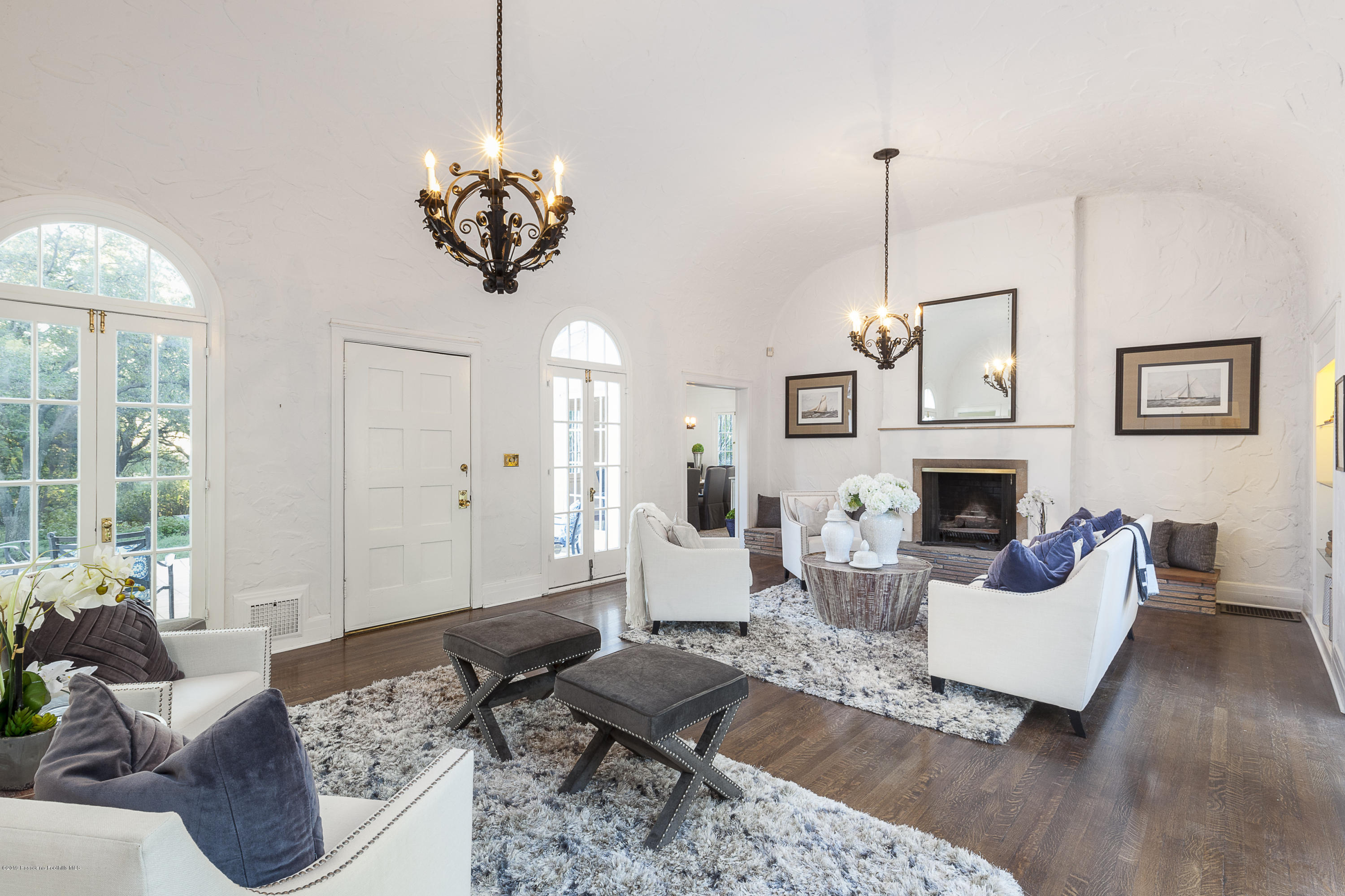 3130 Maiden Lane Altadena, CA 91001 - Photo 7 of 89 a living room with furniture a fireplace and a chandelier