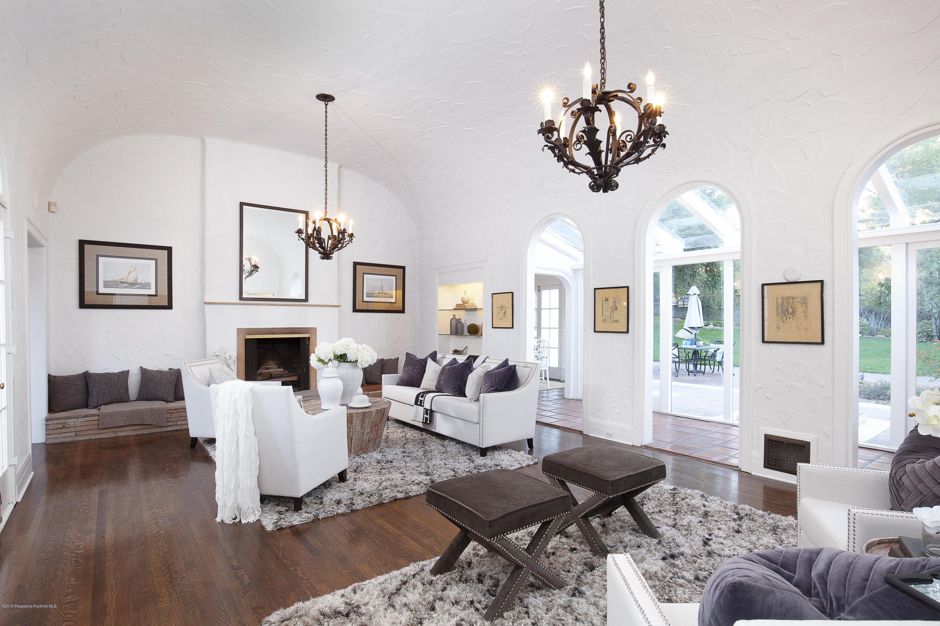 3130 Maiden Lane Altadena, CA 91001 - Photo 8 of 89 a living room with furniture a chandelier and a fireplace