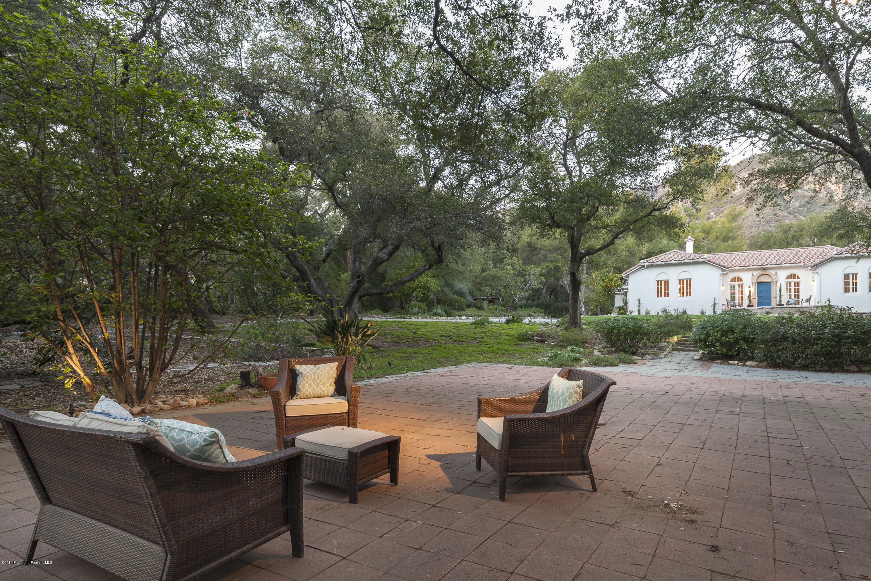 3130 Maiden Lane Altadena, CA 91001 - Photo 77 of 89 a view of a patio with couches chairs and a fire pit