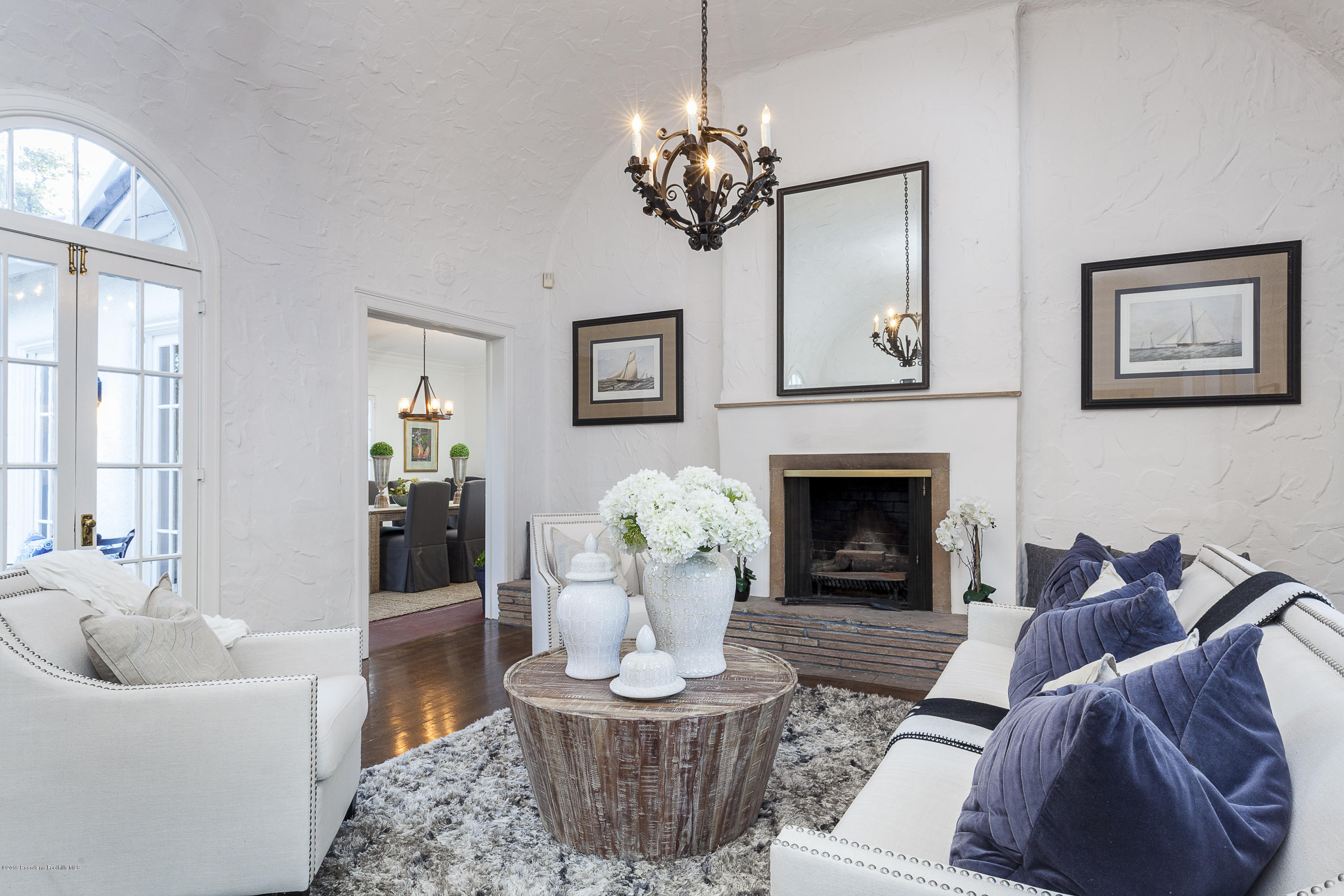 3130 Maiden Lane Altadena, CA 91001 - Photo 10 of 89 a living room with furniture a chandelier and a fireplace