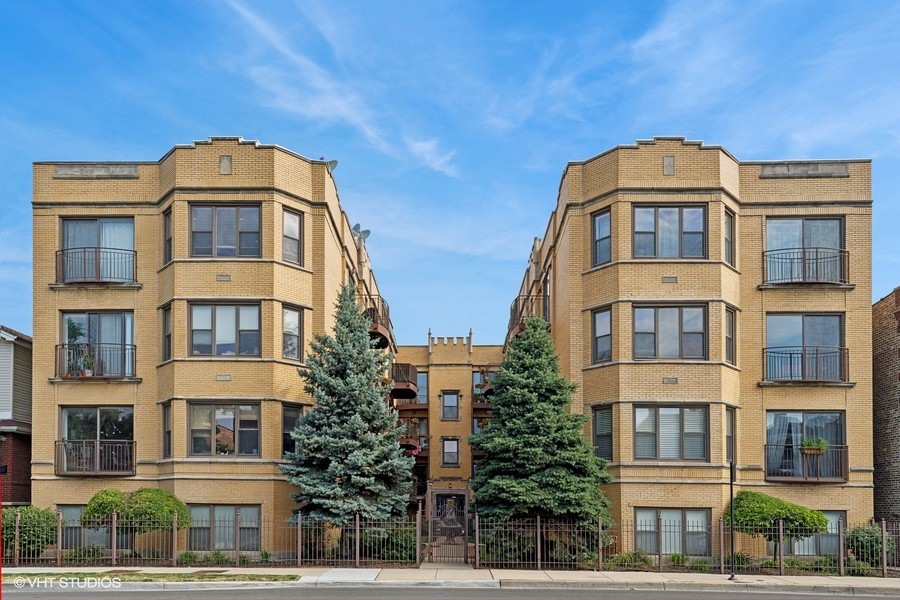 3012 West Addison Street, Unit 4S Chicago, IL 60618 - Photo 1 of 16 a front view of residential houses
