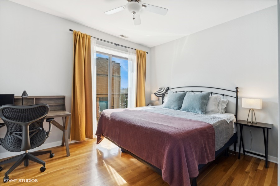 3012 West Addison Street, Unit 4S Chicago, IL 60618 - Photo 11 of 16 a bedroom with a bed and a table chair