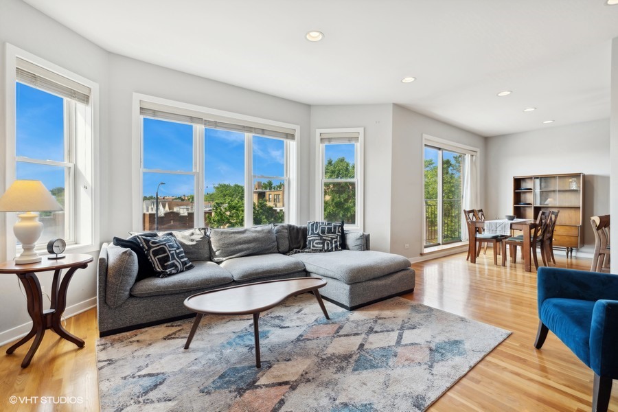3012 West Addison Street, Unit 4S Chicago, IL 60618 - Photo 3 of 16 a living room with furniture wooden floor and a table
