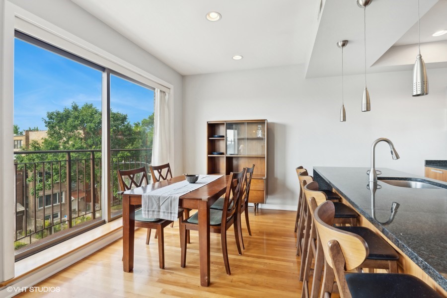 3012 West Addison Street, Unit 4S Chicago, IL 60618 - Photo 9 of 16 a view of a dining room with furniture window and outside view