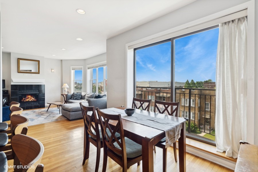 3012 West Addison Street, Unit 4S Chicago, IL 60618 - Photo 10 of 16 a view of a dining room with furniture window and wooden floor