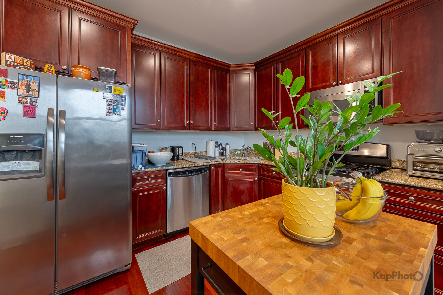 2340 West Adams Street, Unit 32 Chicago, IL 60612 - Photo 11 of 31 a kitchen with stainless steel appliances granite countertop a refrigerator a microwave a sink and a stove