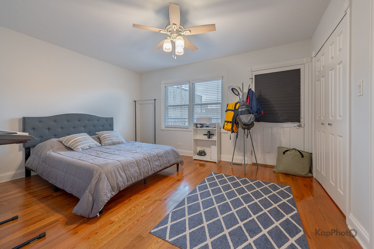 2340 West Adams Street, Unit 32 Chicago, IL 60612 - Photo 15 of 31 a bedroom with a bed and a chandelier
