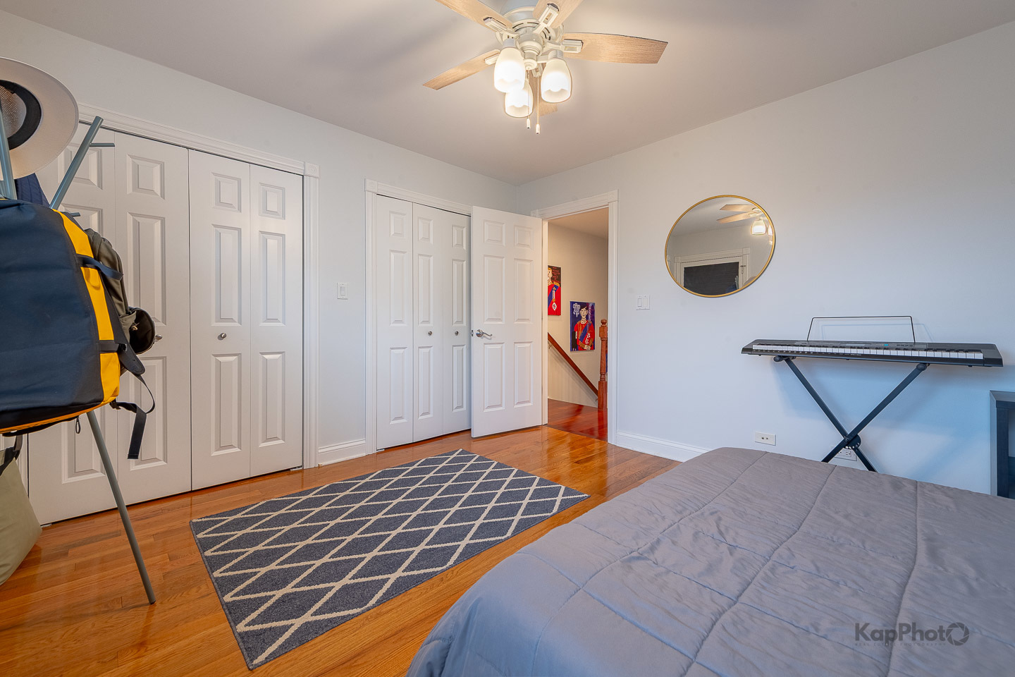 2340 West Adams Street, Unit 32 Chicago, IL 60612 - Photo 17 of 31 a bedroom with bed and wooden floor