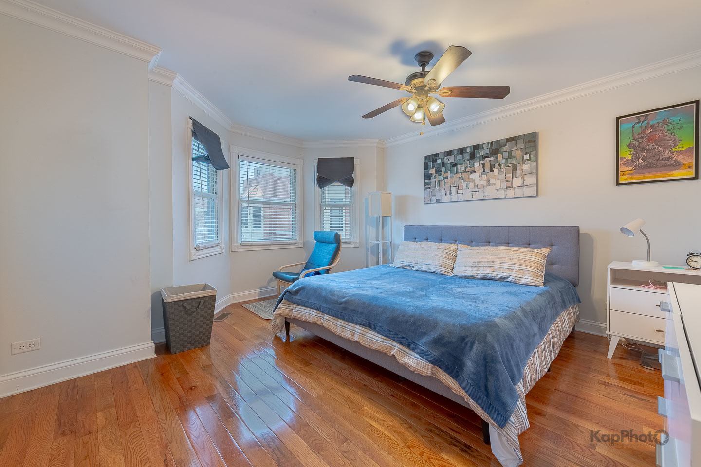 2340 West Adams Street, Unit 32 Chicago, IL 60612 - Photo 18 of 31 a bedroom with a bed and a chandelier