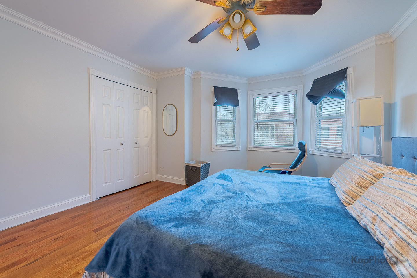 2340 West Adams Street, Unit 32 Chicago, IL 60612 - Photo 20 of 31 a bedroom with a large bed and a chandelier