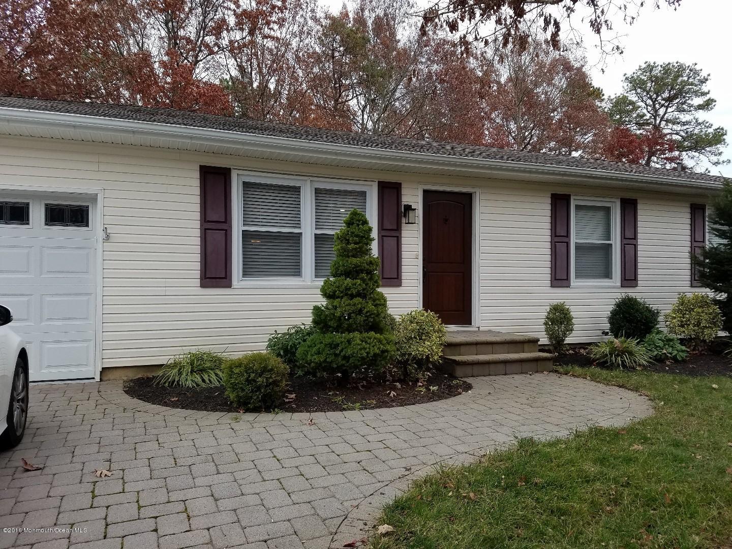 181 Stowaway Road Manahawkin, NJ 08050 - Photo 1 of 6 a front view of a house with a yard