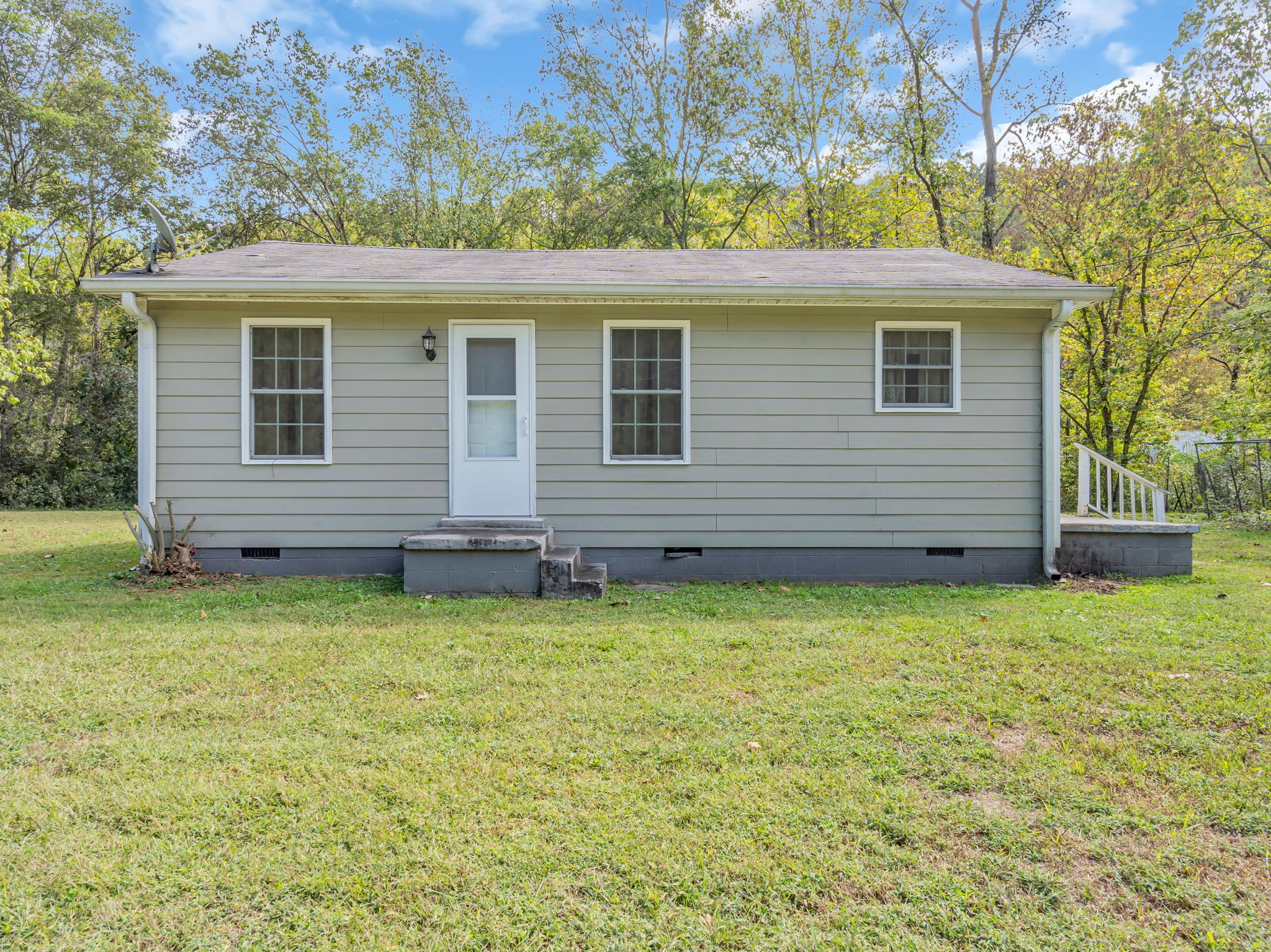 1297 Dry Creek Road Ashland City, TN 37015 - Photo 1 of 27 a view of a house with a backyard