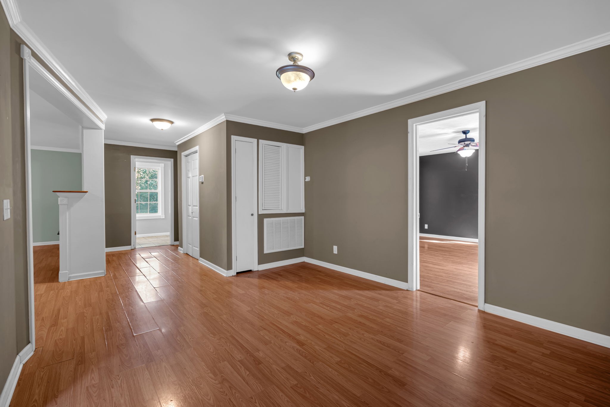 1297 Dry Creek Road Ashland City, TN 37015 - Photo 11 of 27 a view of an empty room with wooden floor and a window