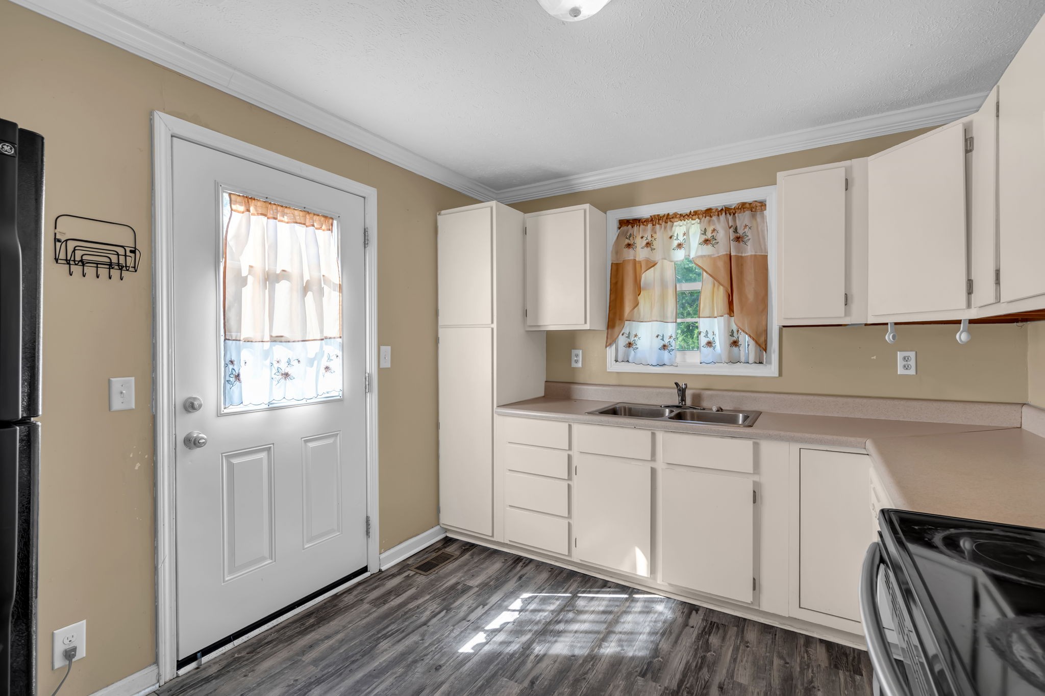 1297 Dry Creek Road Ashland City, TN 37015 - Photo 14 of 27 a kitchen with a sink cabinets and window