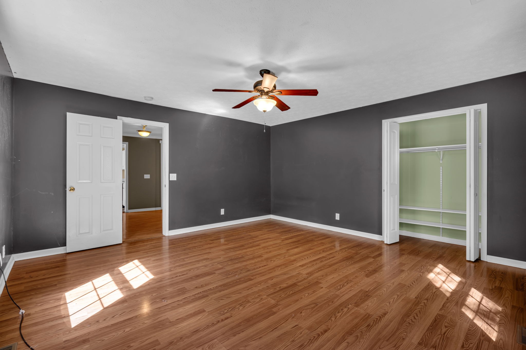 1297 Dry Creek Road Ashland City, TN 37015 - Photo 17 of 27 wooden floor in an empty room with a window