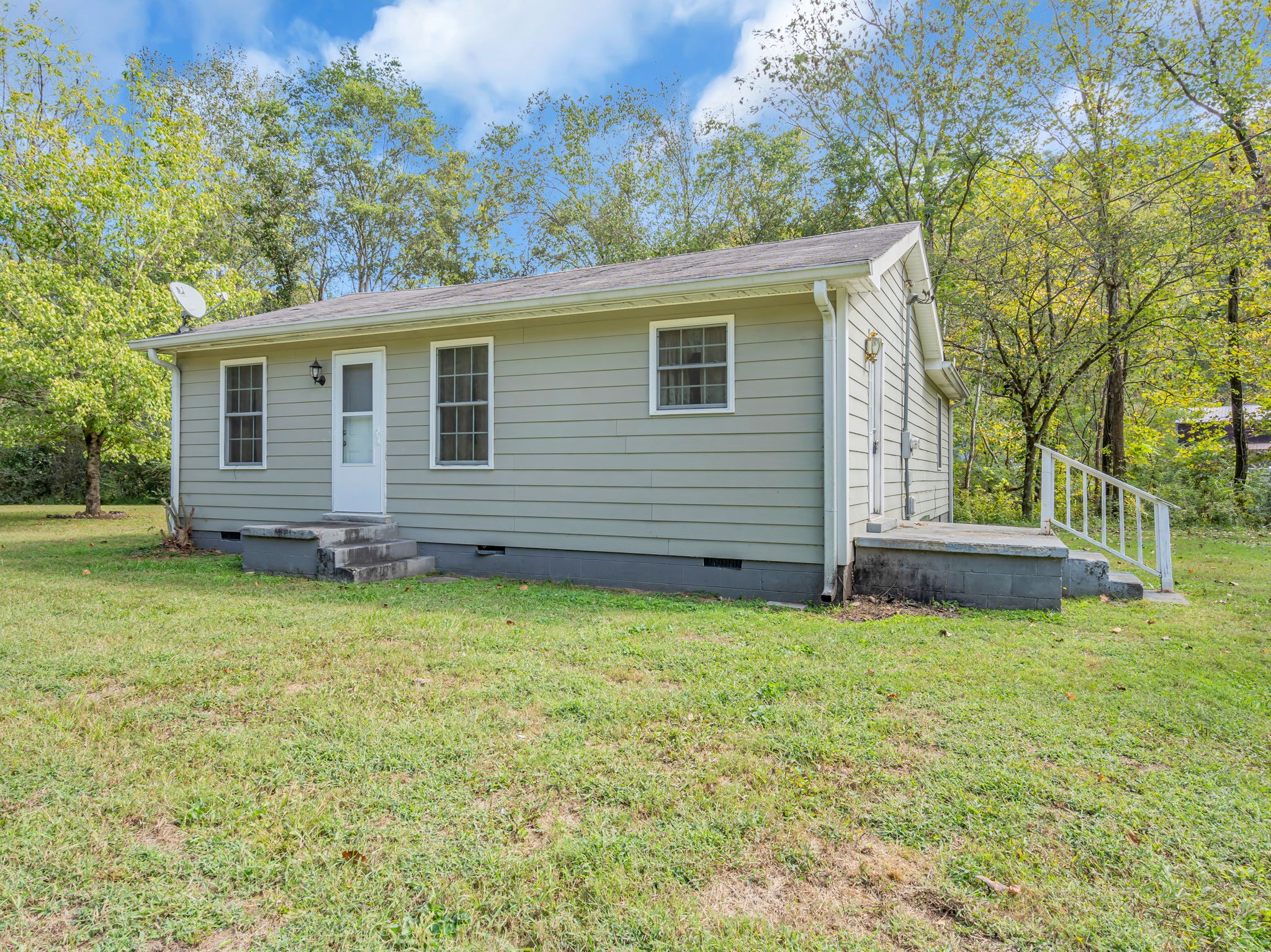 1297 Dry Creek Road Ashland City, TN 37015 - Photo 2 of 27 a view of a house with a backyard