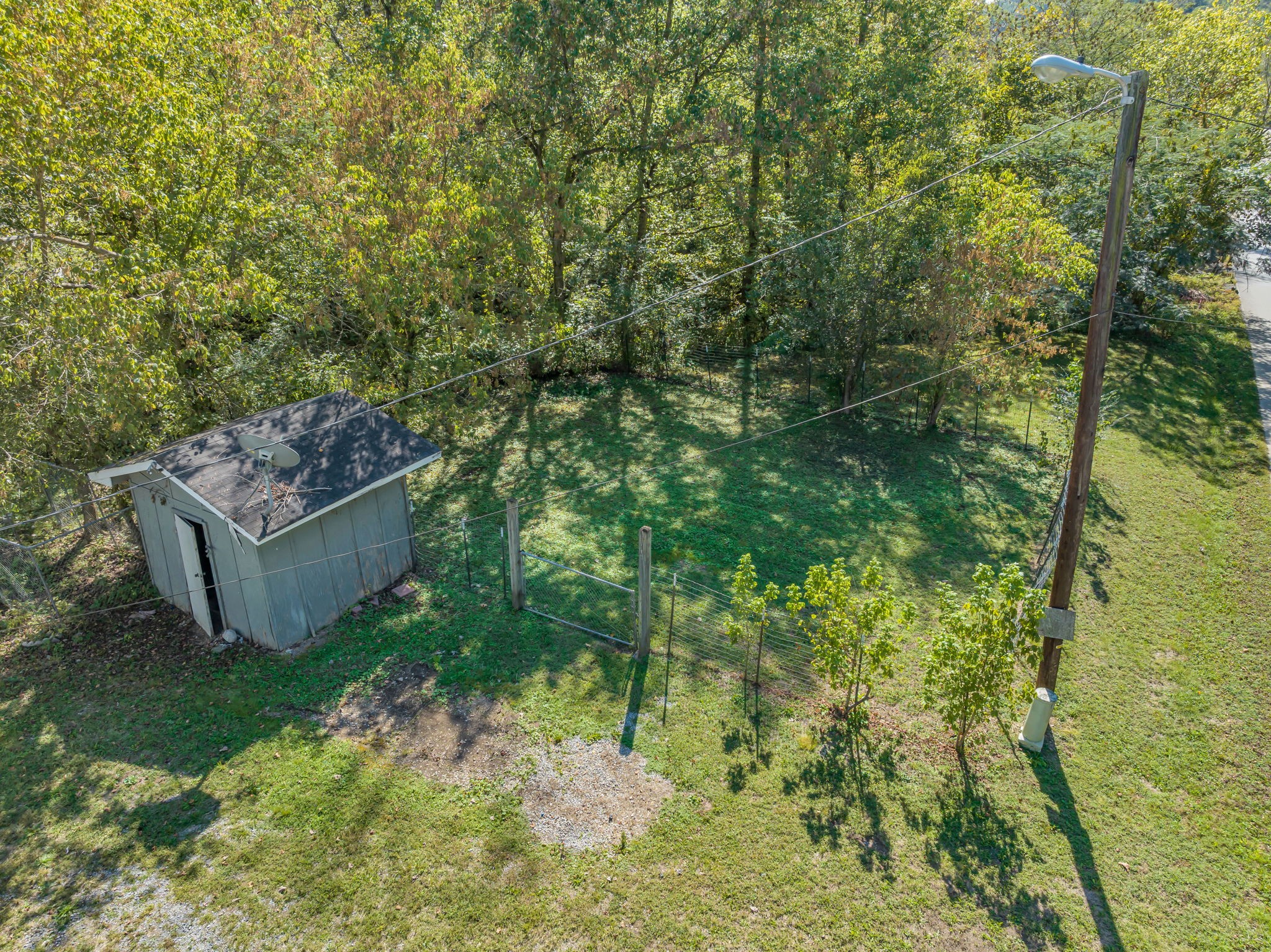 1297 Dry Creek Road Ashland City, TN 37015 - Photo 24 of 27 a backyard of a house with lots of green space