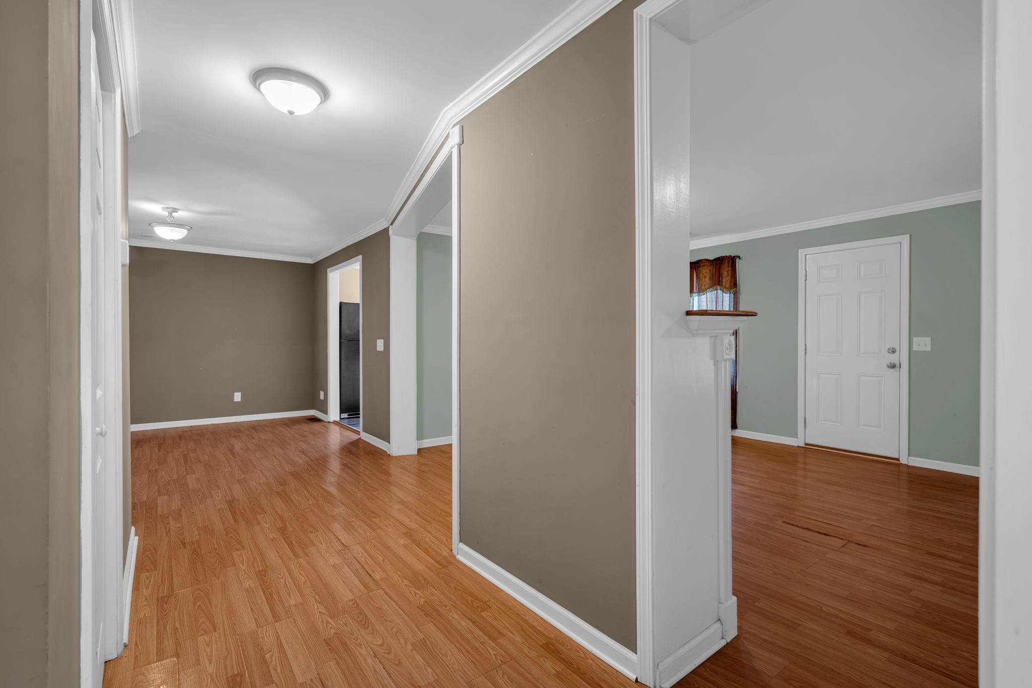 1297 Dry Creek Road Ashland City, TN 37015 - Photo 8 of 27 wooden floor in an empty room with wooden floor