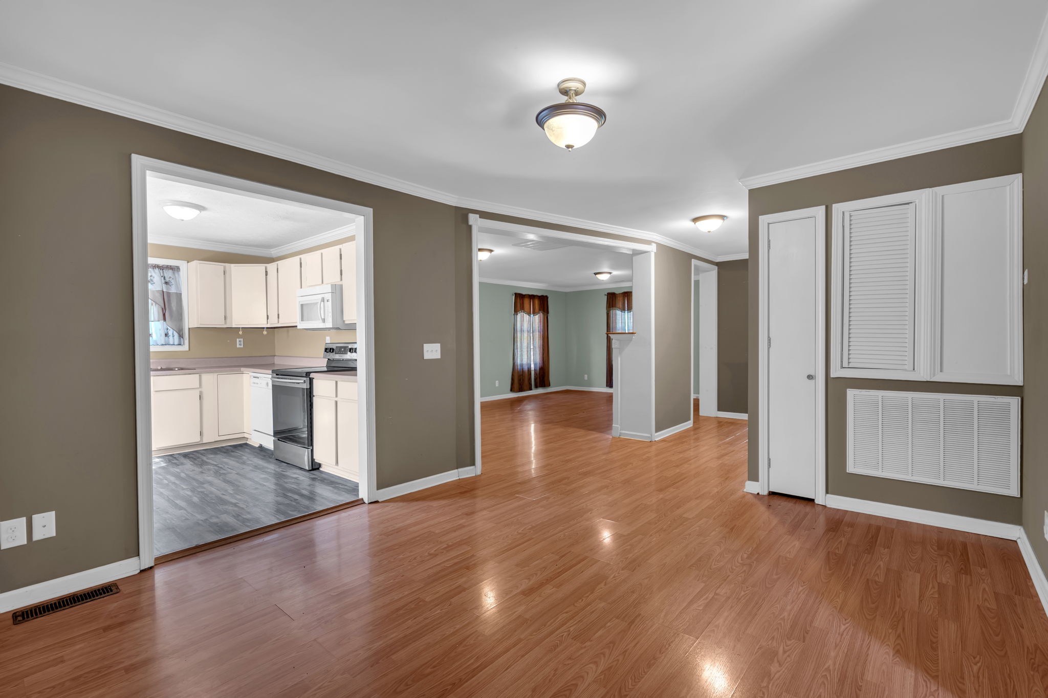 1297 Dry Creek Road Ashland City, TN 37015 - Photo 10 of 27 a view of a kitchen with wooden floor and a refrigerator