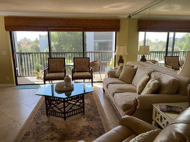 1605 Highway 1, Unit A301 Jupiter, FL 33477 - Photo 11 of 35 a living room with furniture and a large window