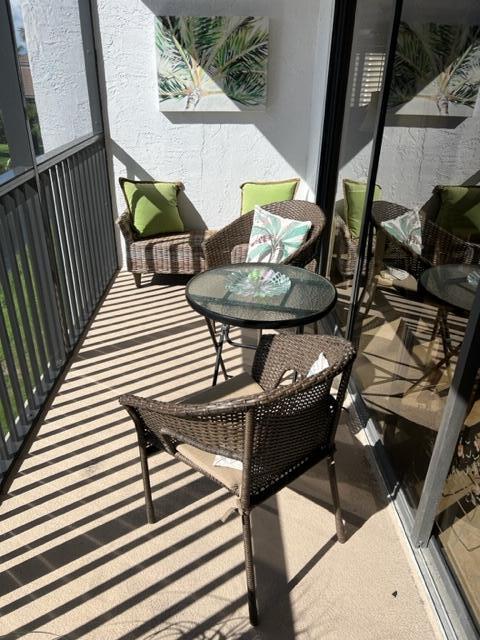 1605 Highway 1, Unit A301 Jupiter, FL 33477 - Photo 12 of 35 a balcony view with couple of chairs
