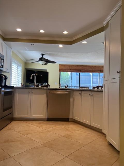 1605 Highway 1, Unit A301 Jupiter, FL 33477 - Photo 15 of 35 a kitchen with a refrigerator and a sink