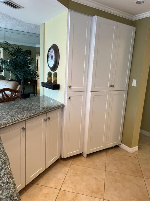 1605 Highway 1, Unit A301 Jupiter, FL 33477 - Photo 18 of 35 a view of a storage and utility room with washer and dryer